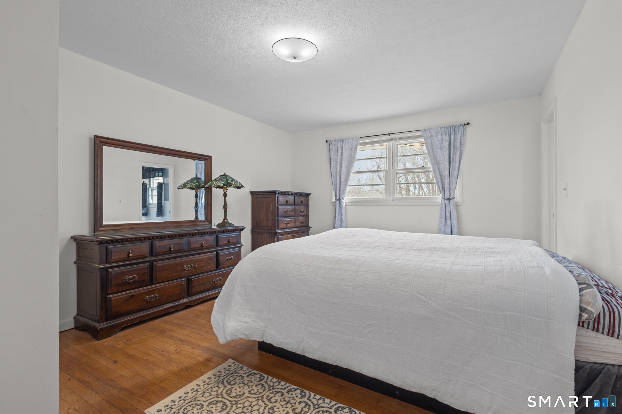 226 Beaumont Highway Lebanon, CT 06249 - Photo 27 of 43 a bedroom with a bed and dresser