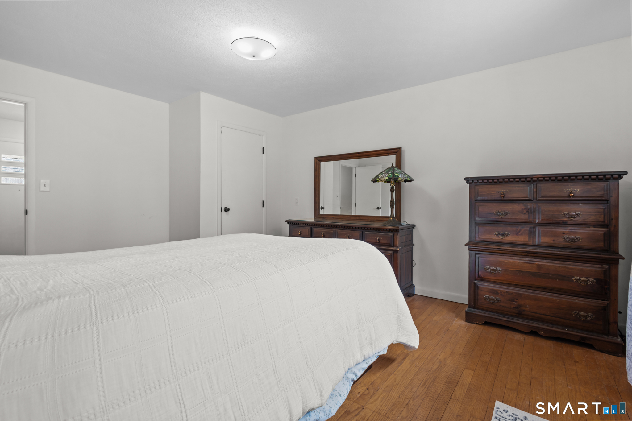 226 Beaumont Highway Lebanon, CT 06249 - Photo 30 of 43 a bedroom with a bed and a dresser