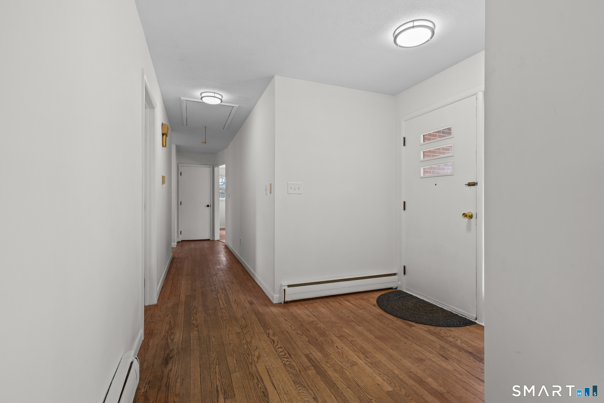 226 Beaumont Highway Lebanon, CT 06249 - Photo 8 of 43 a view of a hallway with wooden floor