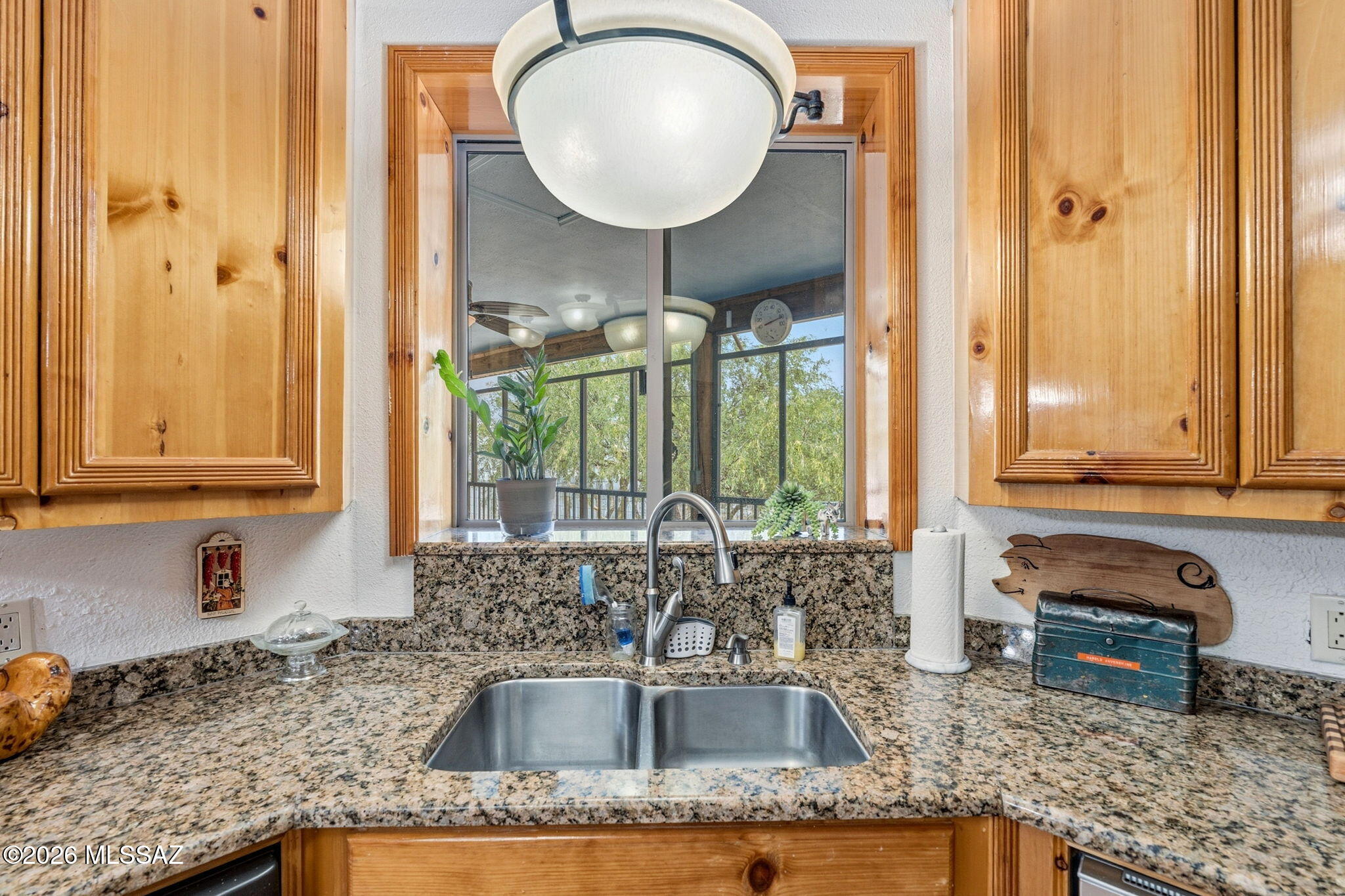 12810 West Gunsmoke Road Tucson, AZ 85736 - Photo 17 of 51 a kitchen with granite countertop a sink and a window