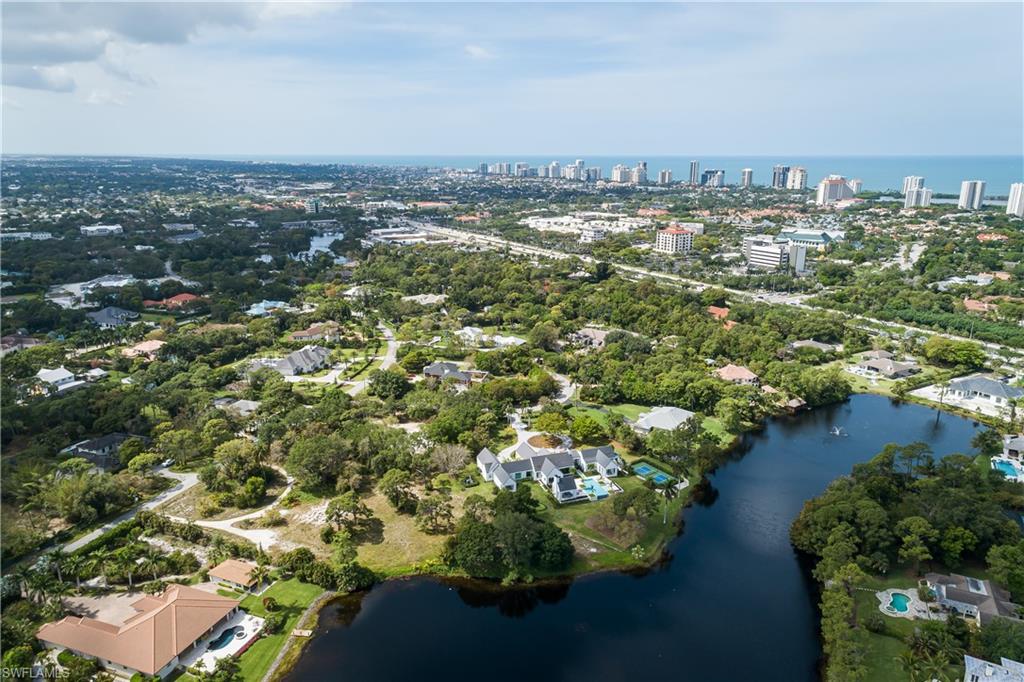 151 Caribbean Road Naples, FL 34108 - Photo 5 of 7 an aerial view of a house with a yard