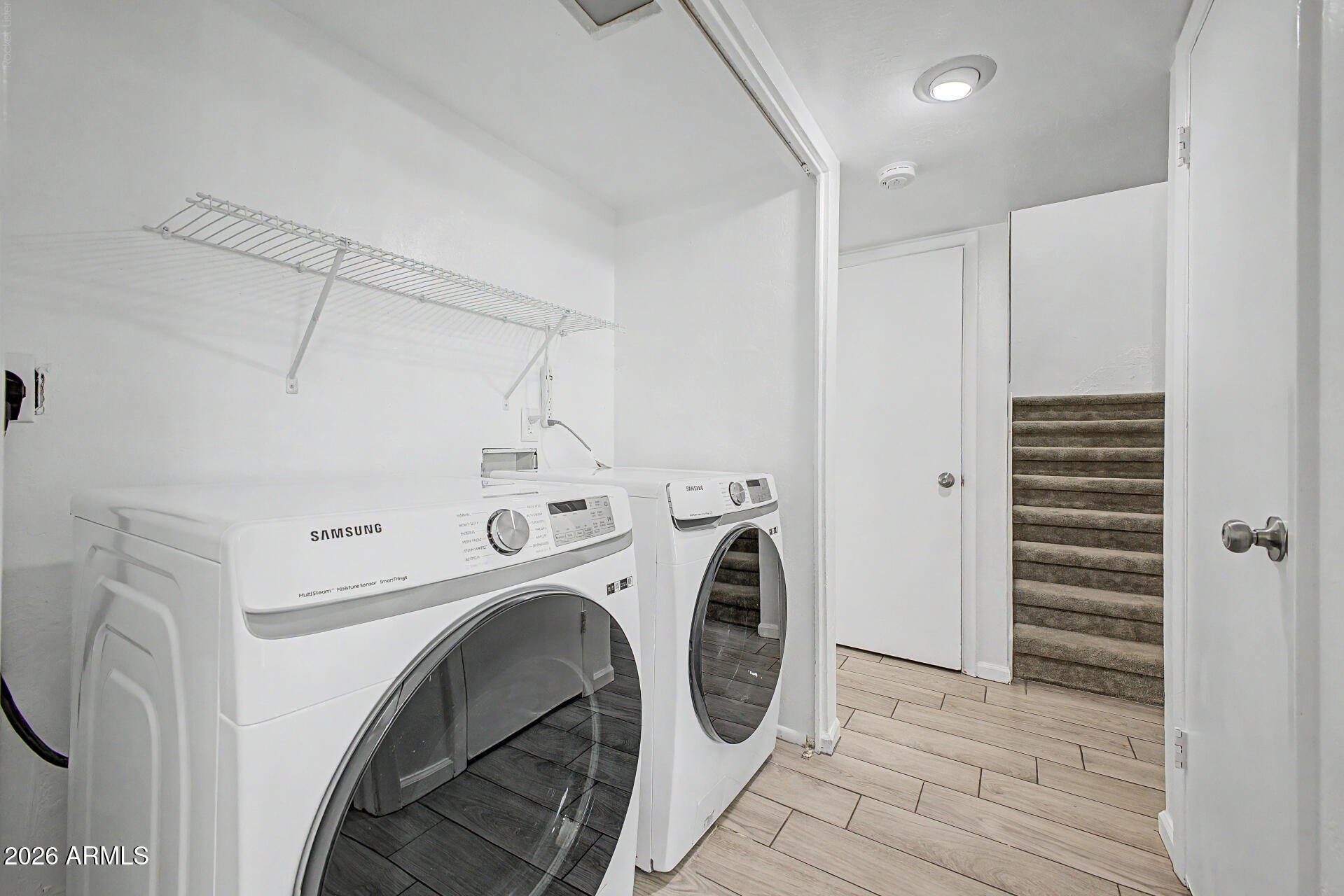 2455 East Broadway Road, Unit 103 Mesa, AZ 85204 - Photo 19 of 22 a view of storage and utility room with washer and dryer