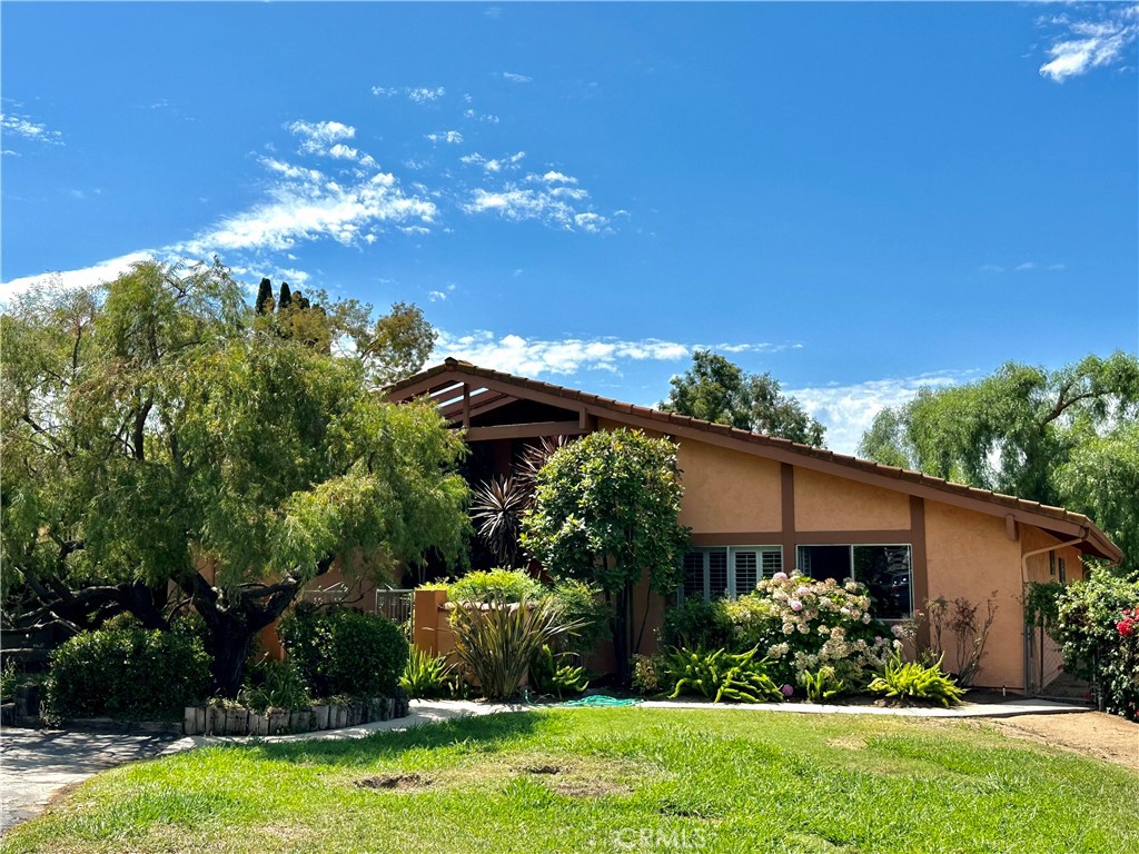 2035 East Mission Road Fallbrook, CA 92028 - Photo 1 of 1 a view of a house with a yard