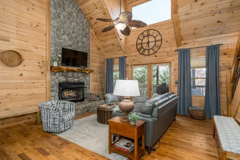 a view of a dining room with furniture and chandelier
