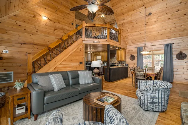 a outdoor space with lots of chairs and a table