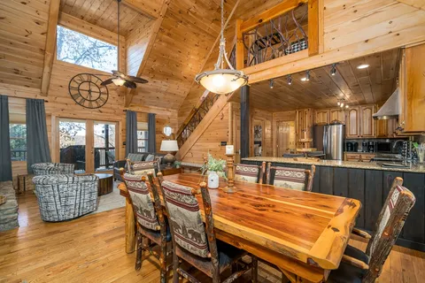 a kitchen with a sink a counter space appliances and cabinets