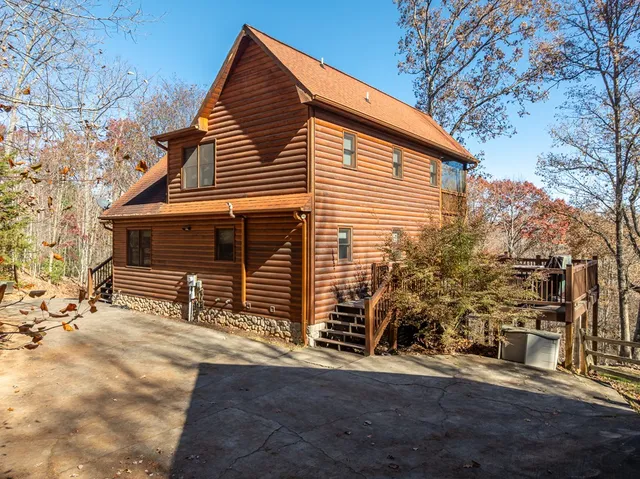 a view of a house with a yard and garage