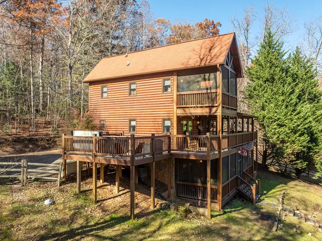 a view of a house with wooden deck