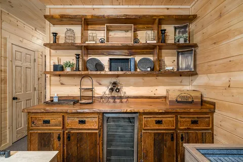a view of a porch with furniture and a yard