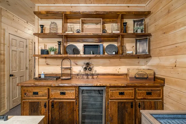 a view of a porch with furniture and a yard