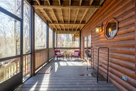 a bathroom with a granite countertop toilet sink and mirror