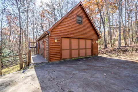a view of balcony with wooden floor and fence