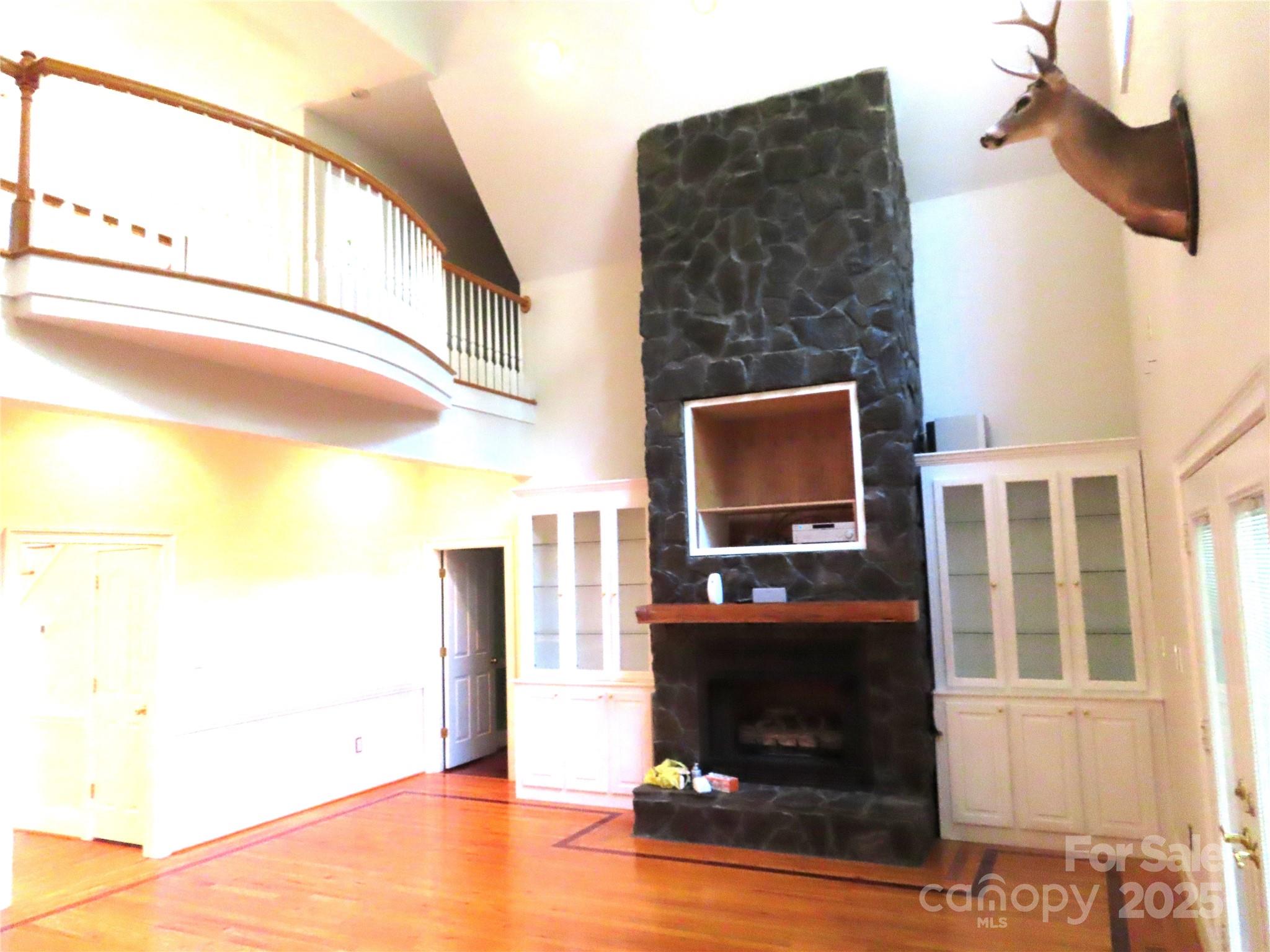 2530 Sharon Road York, SC 29745 - Photo 14 of 41 a living room with a fireplace and a flat screen tv