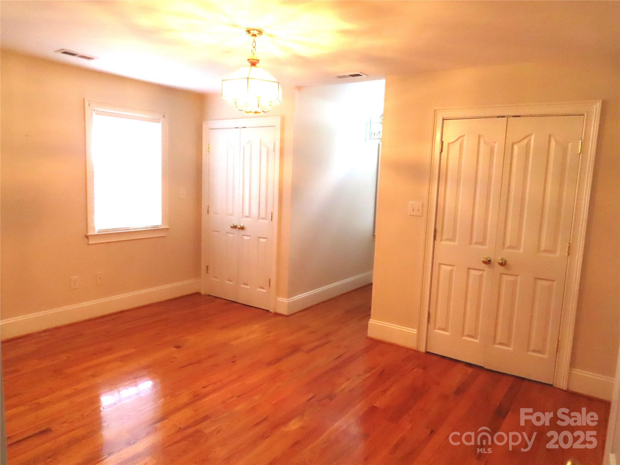 2530 Sharon Road York, SC 29745 - Photo 34 of 41 an empty room with wooden floor and windows