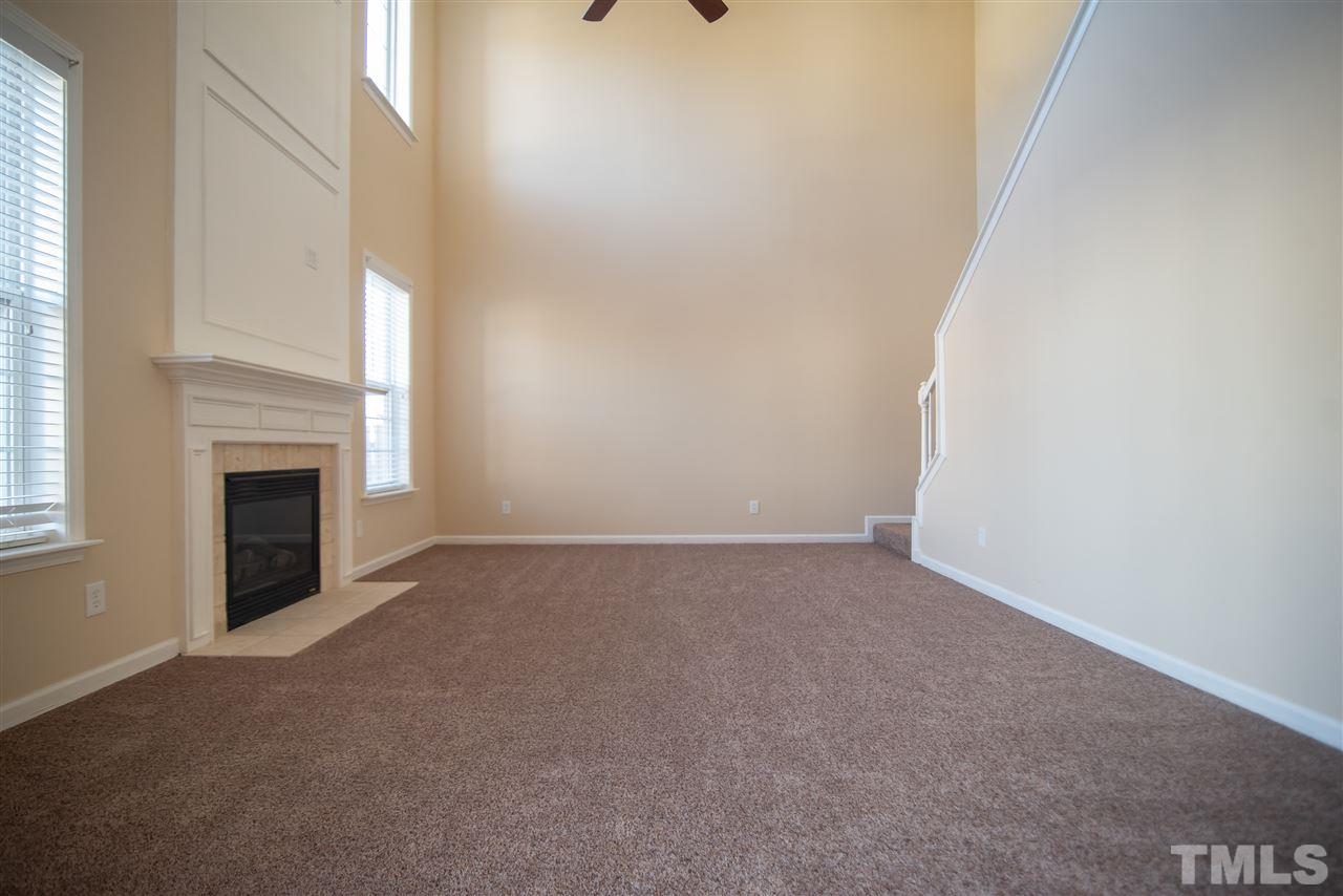 5525 Keowee Way Raleigh, NC 27616 - Photo 11 of 23 Cathedral ceilings creates impressive ambiance in this spacious family room.
