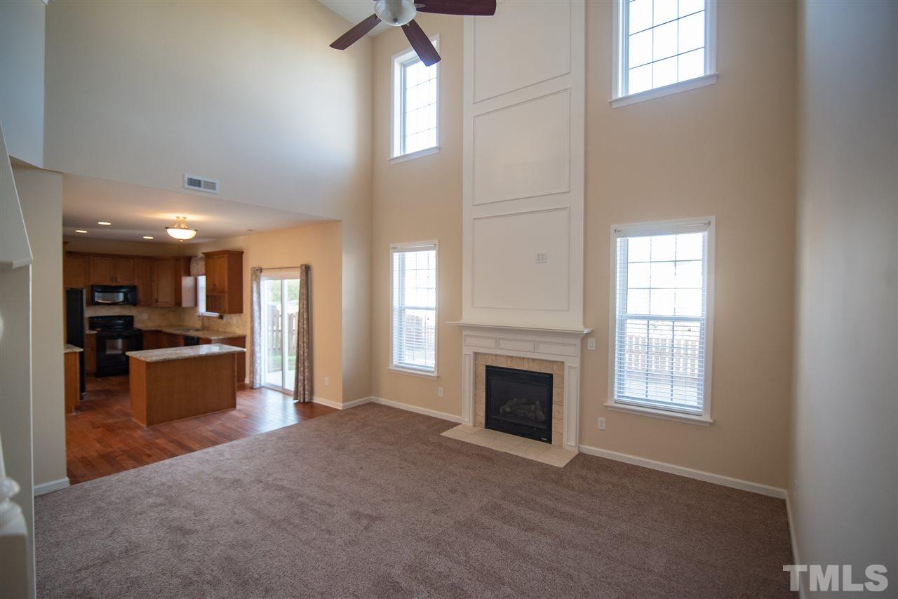 5525 Keowee Way Raleigh, NC 27616 - Photo 12 of 23 Cozy up by the fire in this warm and inviting room.
