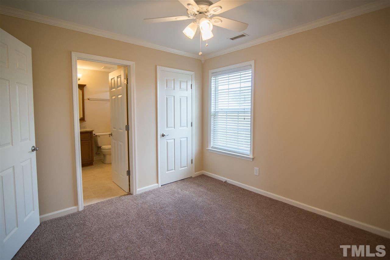 5525 Keowee Way Raleigh, NC 27616 - Photo 20 of 23 This dreamy bedroom features plush carpet and ceiling fan.