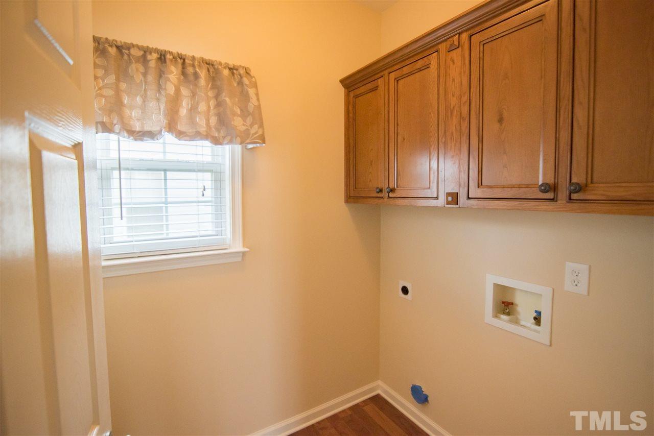 5525 Keowee Way Raleigh, NC 27616 - Photo 21 of 23 The first floor utility room has additional storage to help keep your home organized.