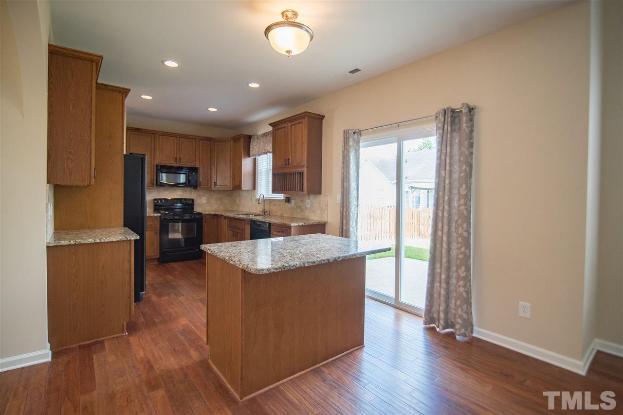 5525 Keowee Way Raleigh, NC 27616 - Photo 8 of 23 The kitchen island provides even MORE space for meal prepping or in kitchen dining.