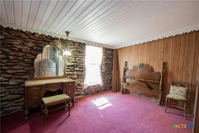 a room with furniture and a gate