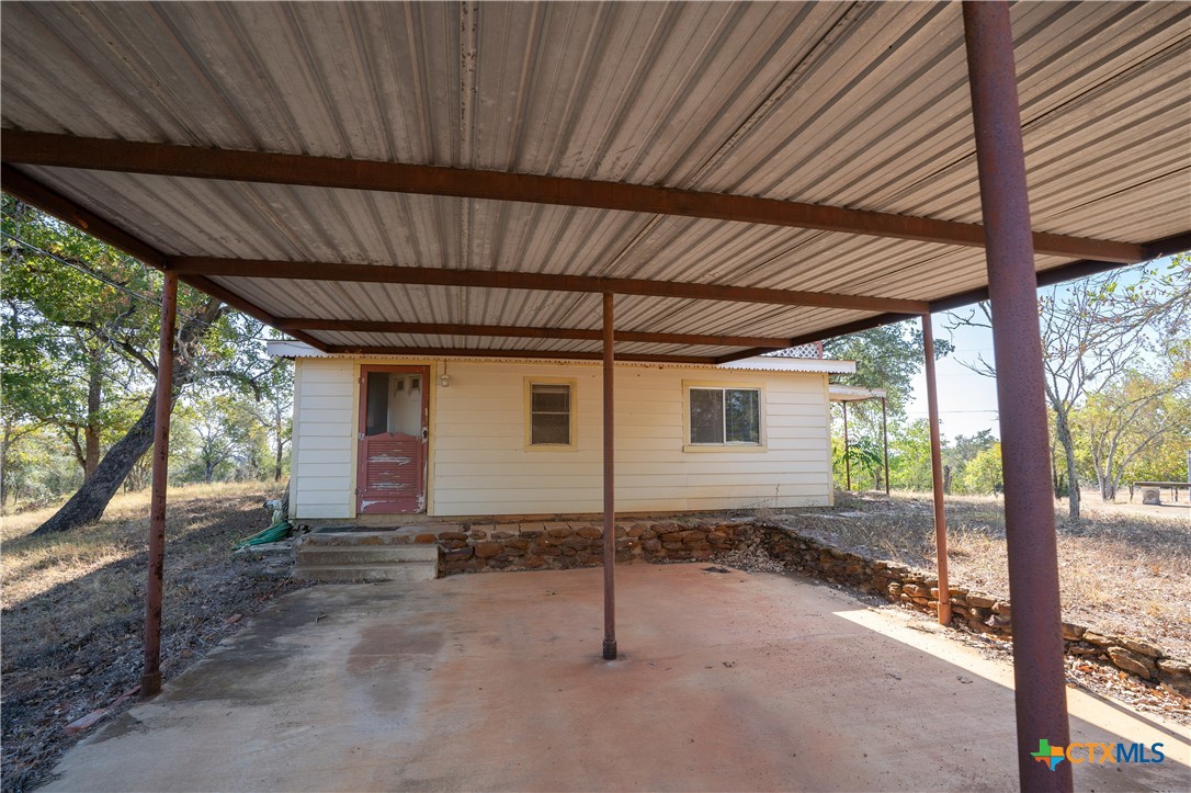3779 Mule Creek Road Harwood, TX 78632 - Photo 33 of 40 a view of a house with a backyard