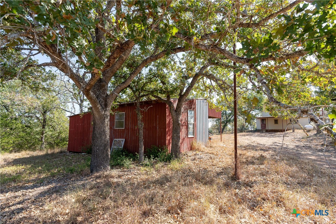 3779 Mule Creek Road Harwood, TX 78632 - Photo 34 of 40 a tree in front of a white house