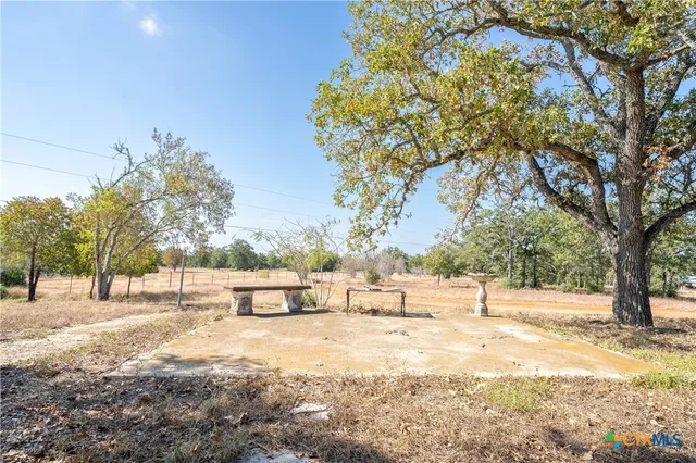 a backyard of a house with lots of trees