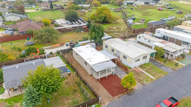 an aerial view of a house with a ocean view