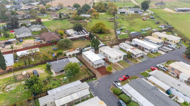 an aerial view of a house with outdoor space