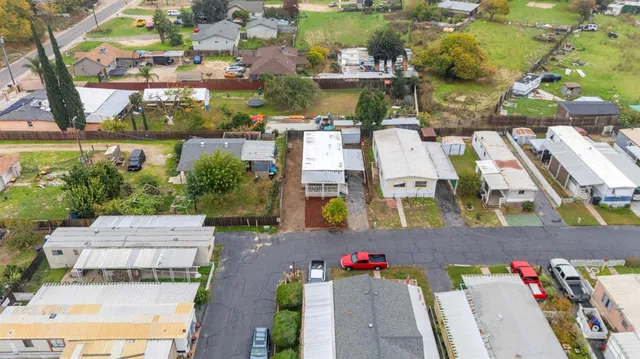 an aerial view of a houses with outdoor space