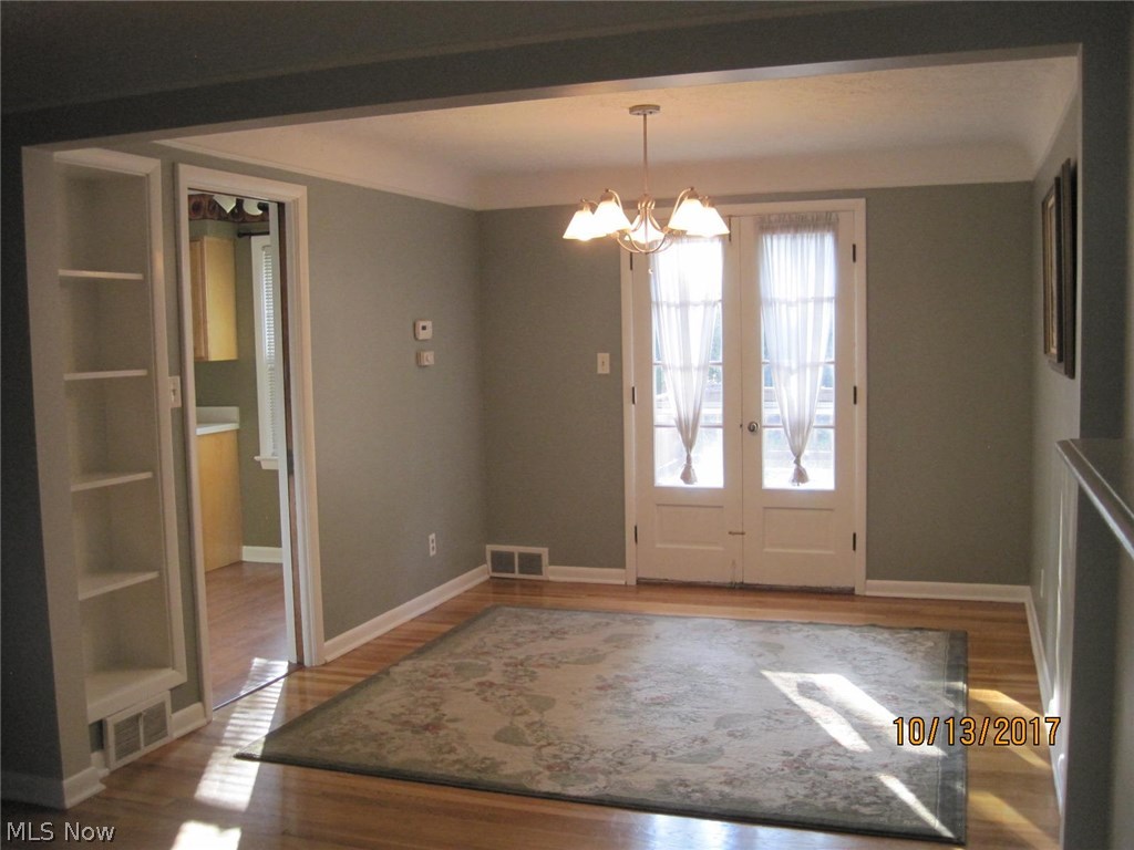 1268 Ford Road Lyndhurst, OH 44124 - Photo 4 of 22 Dining room with builtin shelves and doors leading to Deck.