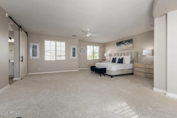 a bedroom with a workspace