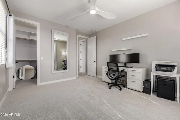 a view of a swimming pool with a patio and a fire pit