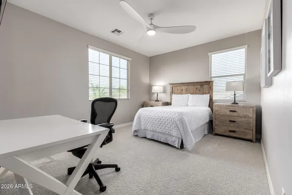 an empty room with a ceiling fan and a ceiling fan
