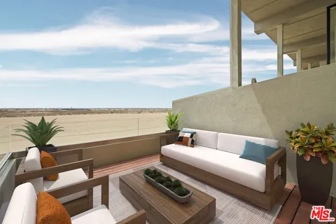 a view of a terrace with couches and a table