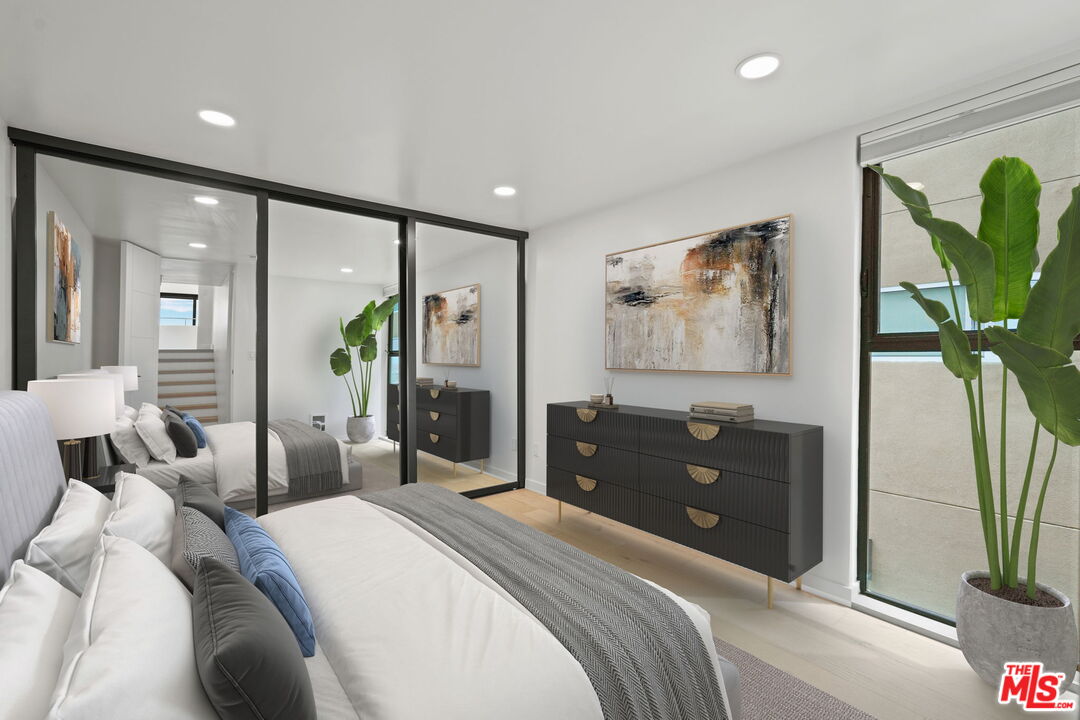 6 Voyage Street, Unit 108 Marina del Rey, CA 90292 - Photo 12 of 27 a bedroom with a bed and a dresser