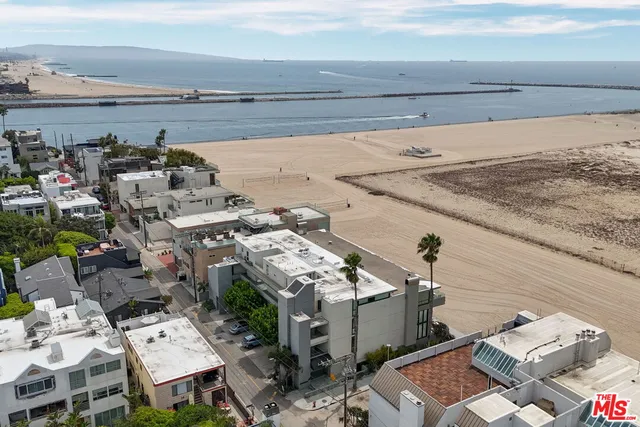 a view of an empty room with windows