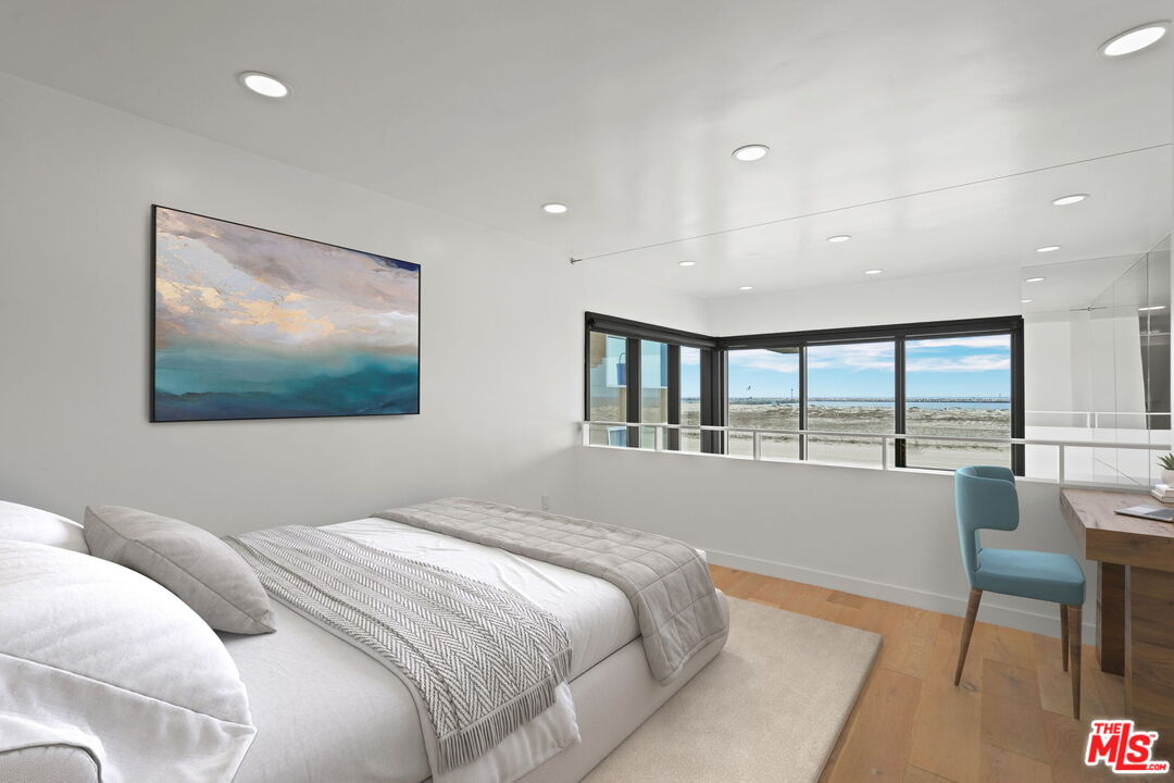 6 Voyage Street, Unit 108 Marina del Rey, CA 90292 - Photo 8 of 27 a bedroom with a bed and a flat screen tv