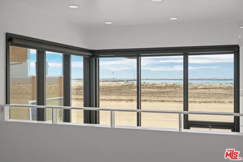 a view of an empty room with a large window