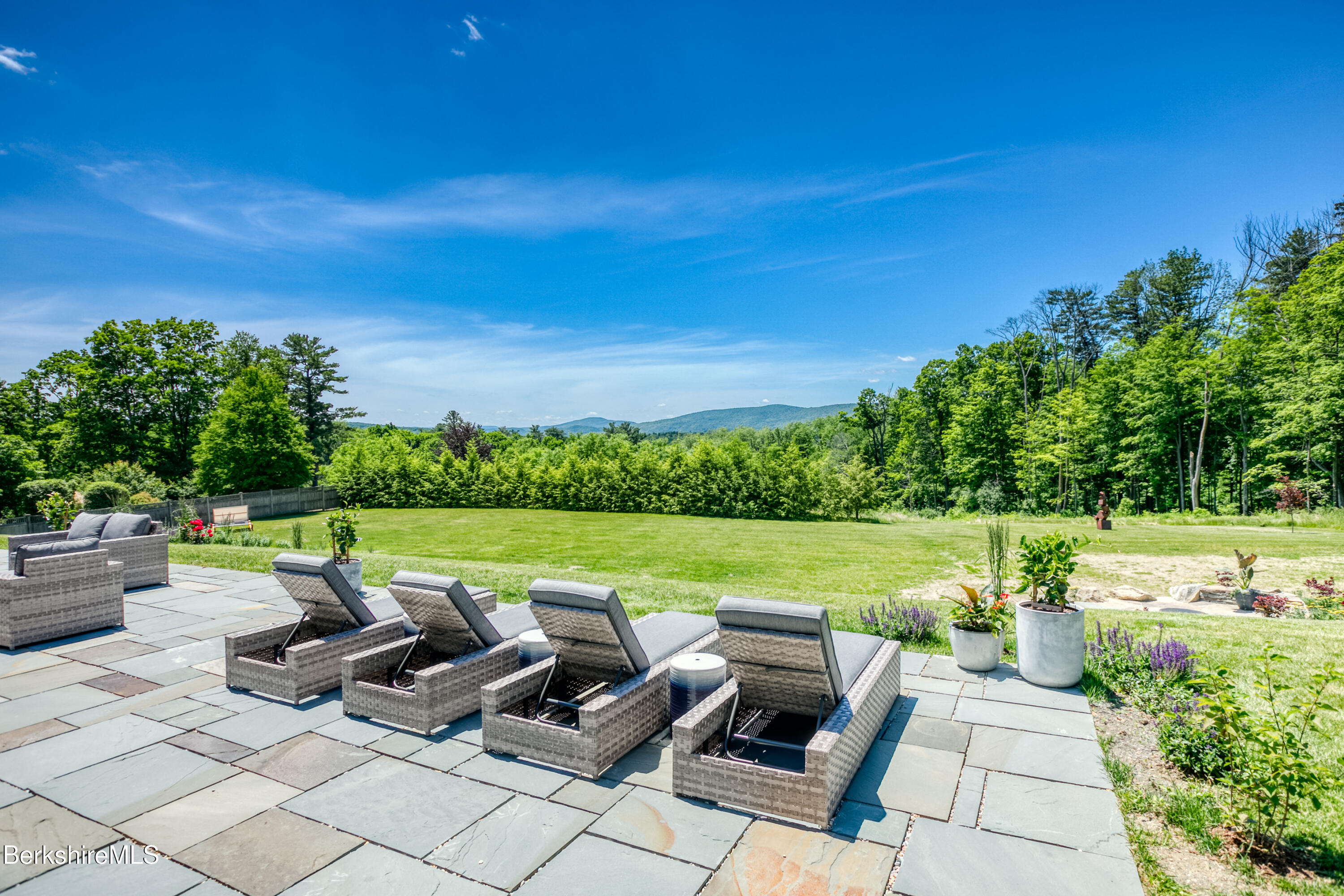 2 Kemble Street Lenox, MA 01240 - Photo 32 of 41 a view of a swimming pool and lounge chairs in back yard