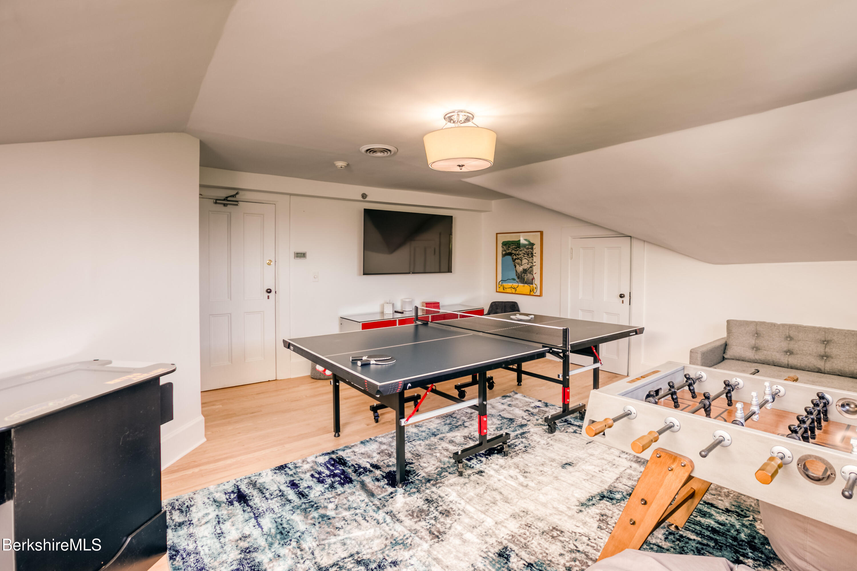 2 Kemble Street Lenox, MA 01240 - Photo 33 of 41 a living room with furniture pool and a flat screen tv