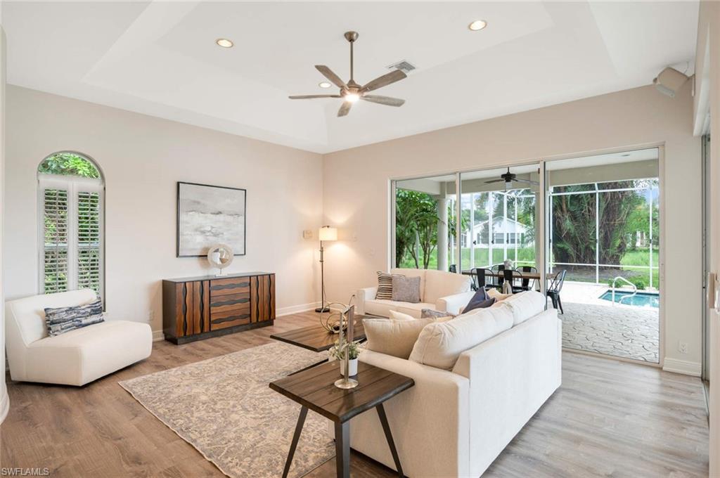 2115 Imperial Golf Course Boulevard Naples, FL 34110 - Photo 12 of 31 a living room with furniture and a large window