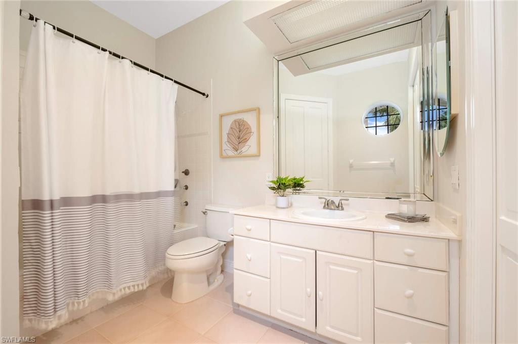 2115 Imperial Golf Course Boulevard Naples, FL 34110 - Photo 20 of 31 a bathroom with a sink a toilet and shower