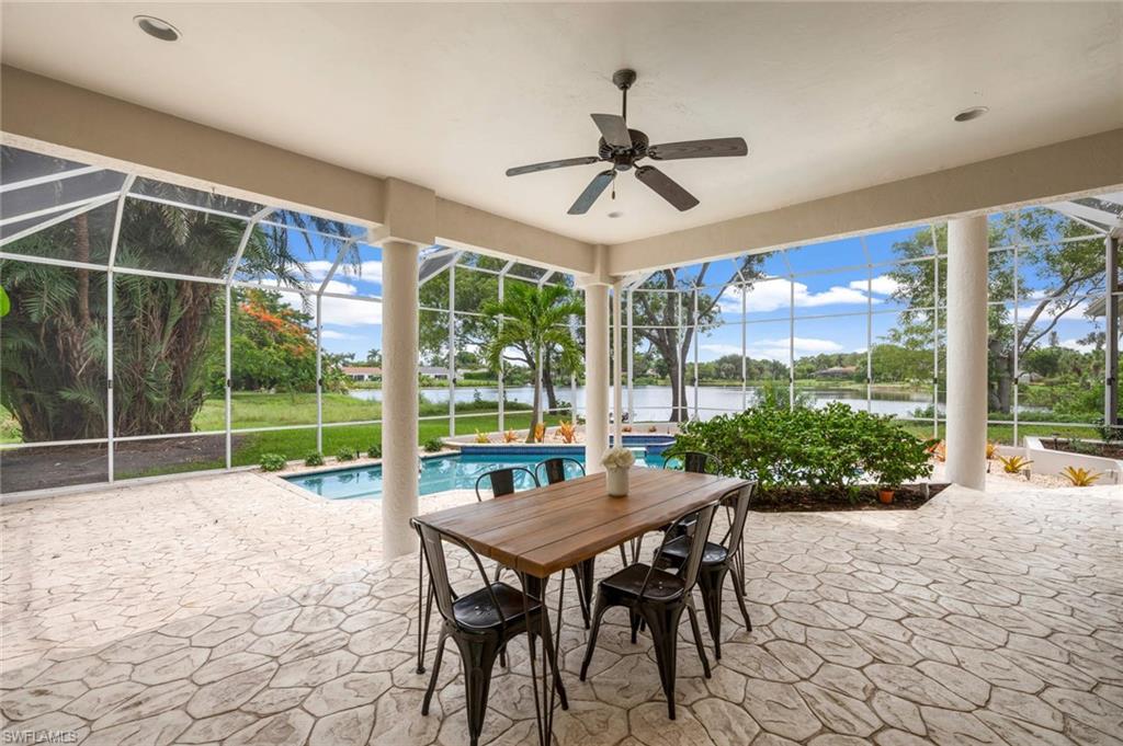 2115 Imperial Golf Course Boulevard Naples, FL 34110 - Photo 22 of 31 a view of a porch with furniture and garden