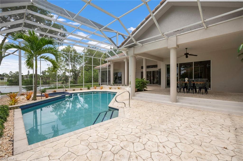 2115 Imperial Golf Course Boulevard Naples, FL 34110 - Photo 24 of 31 a view of swimming pool with outdoor seating and plants