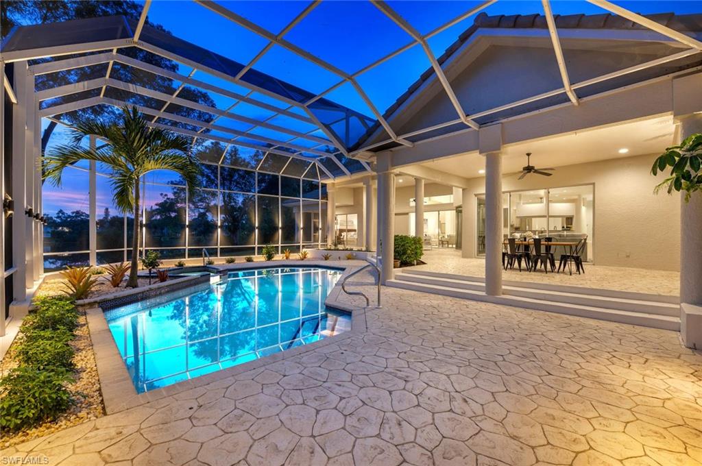 2115 Imperial Golf Course Boulevard Naples, FL 34110 - Photo 28 of 31 a view of swimming pool with a patio