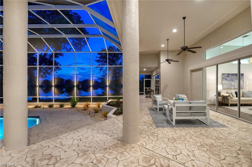 2115 Imperial Golf Course Boulevard Naples, FL 34110 - Photo 30 of 31 a living room with furniture gym equipment and a large window