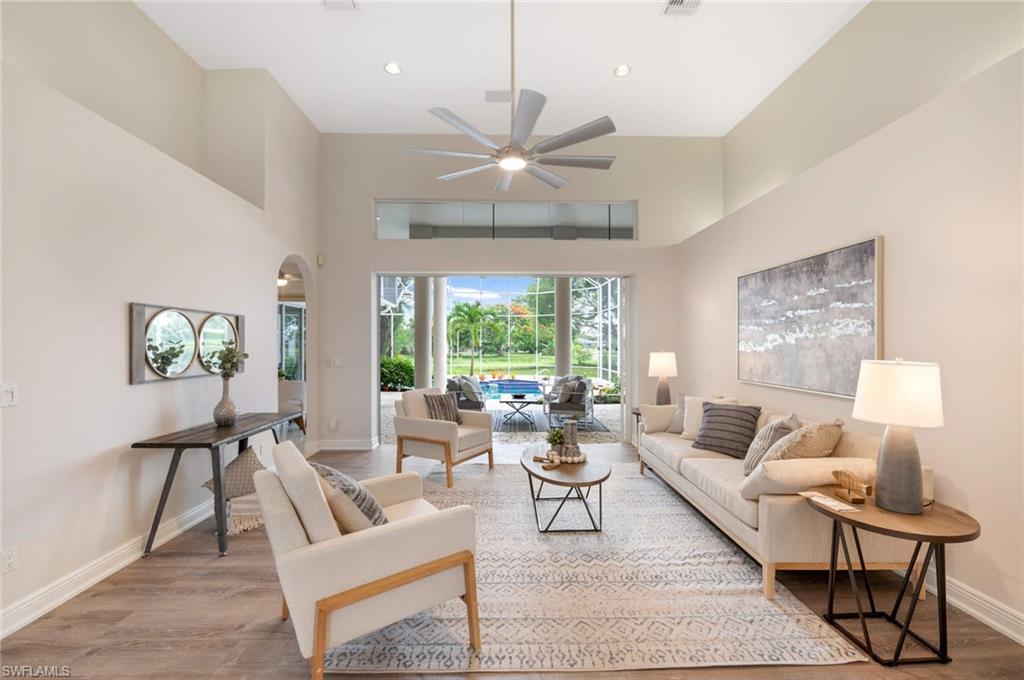 2115 Imperial Golf Course Boulevard Naples, FL 34110 - Photo 5 of 31 a living room with furniture and a large window