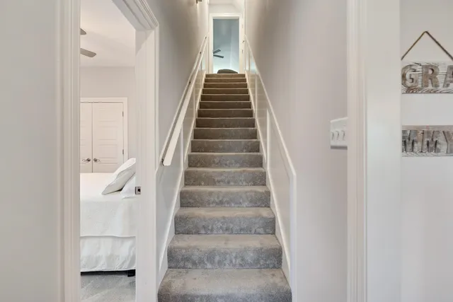 a view of staircase with white walls