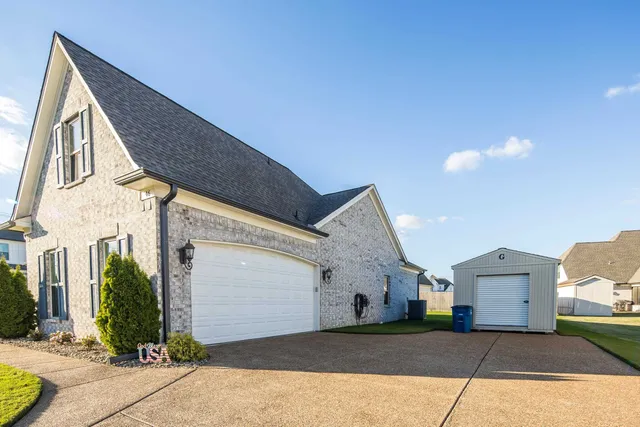 a view of a house with a street